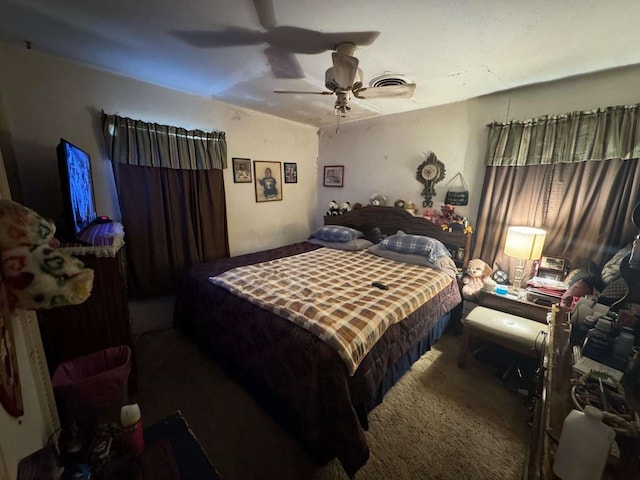 bedroom with carpet, visible vents, and ceiling fan