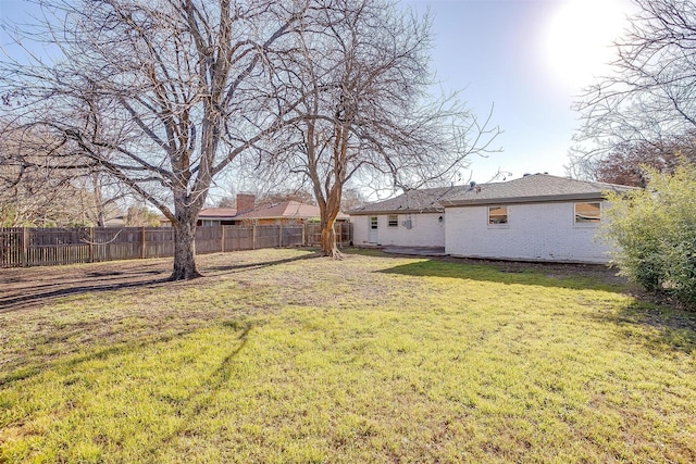 view of yard featuring a fenced backyard