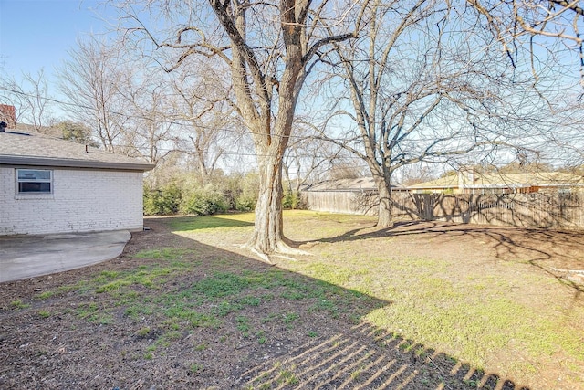 view of yard featuring a patio area and fence