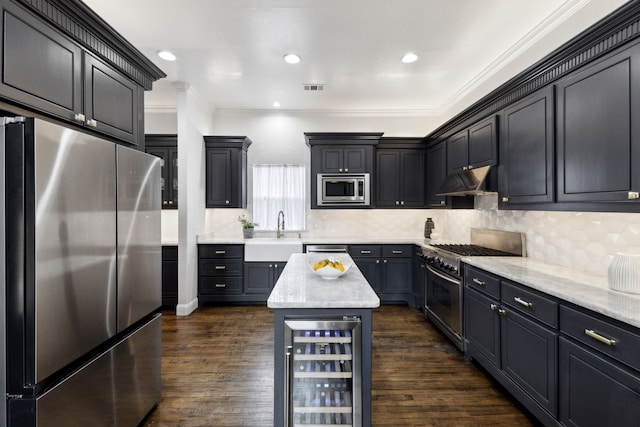 kitchen with visible vents, wine cooler, appliances with stainless steel finishes, under cabinet range hood, and a sink