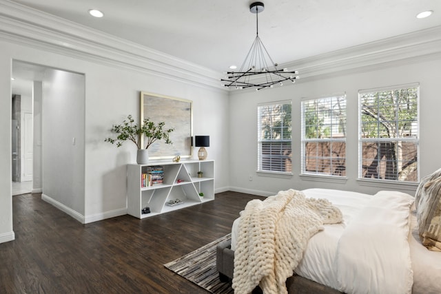 bedroom with ornamental molding, multiple windows, and wood finished floors