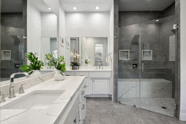 full bath with a stall shower and vanity