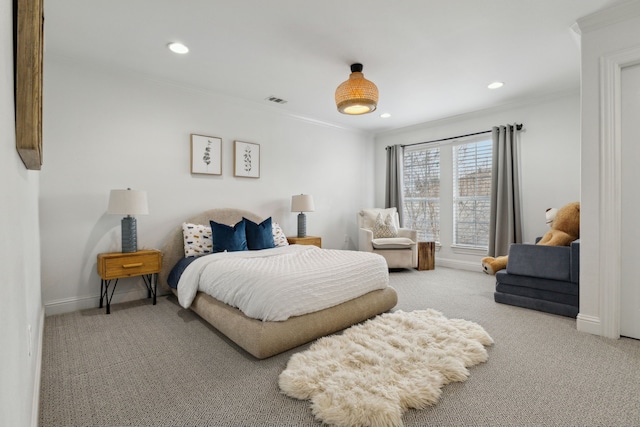 bedroom featuring ornamental molding, carpet, visible vents, and baseboards