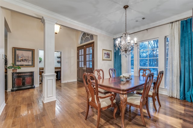 dining area with visible vents, french doors, ornamental molding, and decorative columns