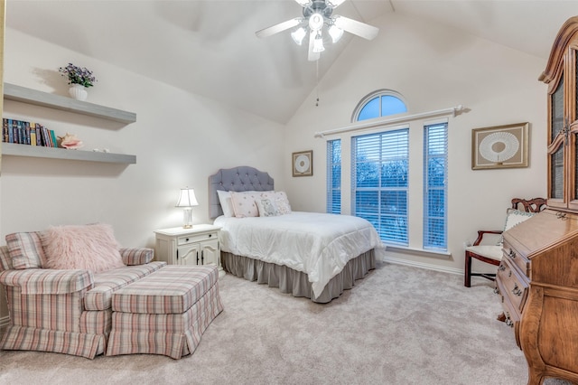 bedroom featuring carpet floors, high vaulted ceiling, and a ceiling fan