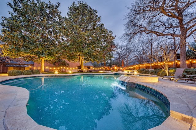 view of swimming pool with a patio area, a fenced backyard, a fenced in pool, and an in ground hot tub