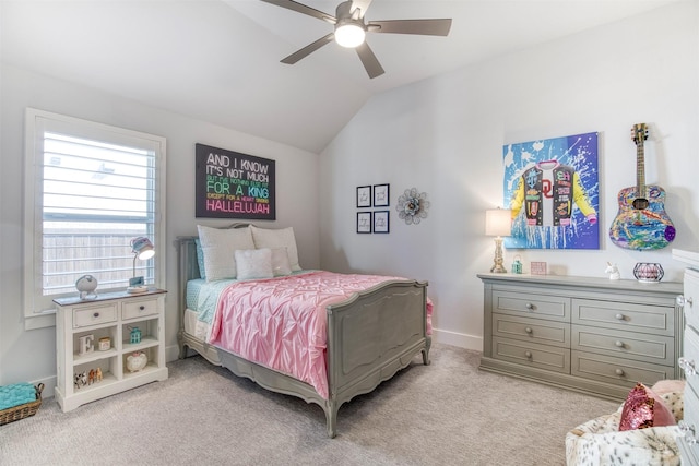 bedroom with lofted ceiling, baseboards, a ceiling fan, and light colored carpet