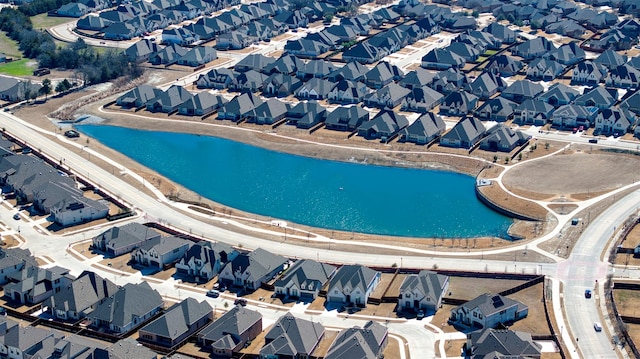 bird's eye view featuring a residential view and a water view