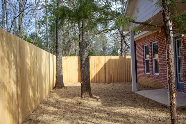 view of yard with a fenced backyard