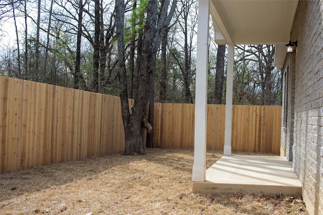 view of yard with a fenced backyard