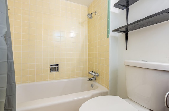 full bathroom with shower / tub combo and toilet