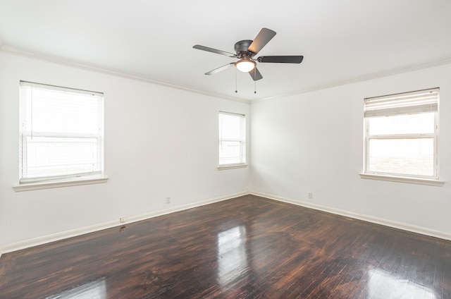 spare room with a ceiling fan, baseboards, ornamental molding, and hardwood / wood-style floors