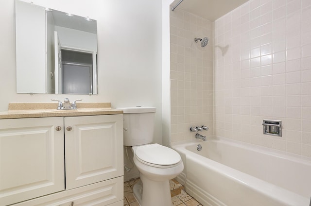 bathroom with toilet, tile patterned floors, vanity, and shower / bathtub combination