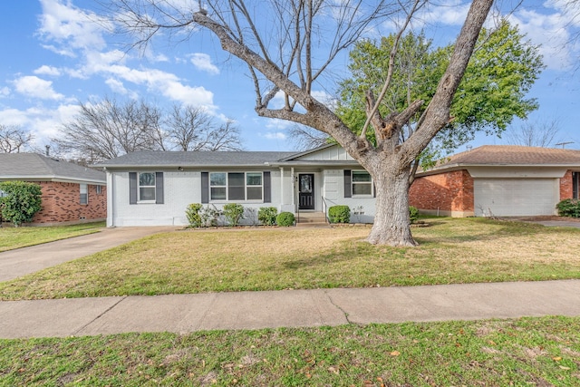 ranch-style house with driveway, brick siding, and a front yard