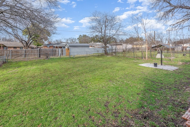 view of yard with a fenced backyard