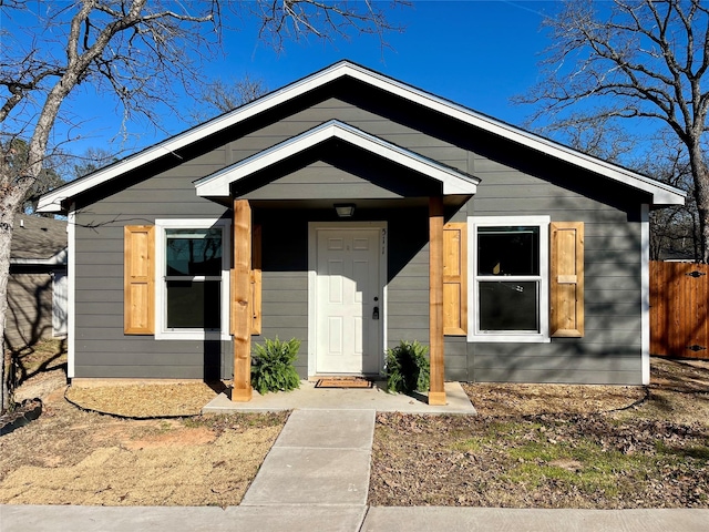 view of front of property featuring fence