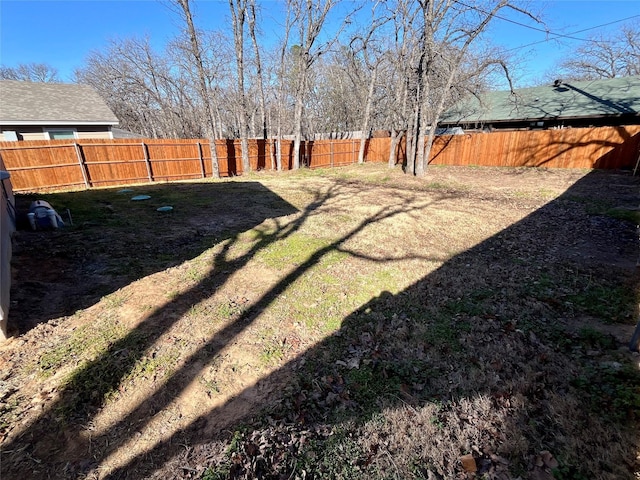 view of yard featuring a fenced backyard