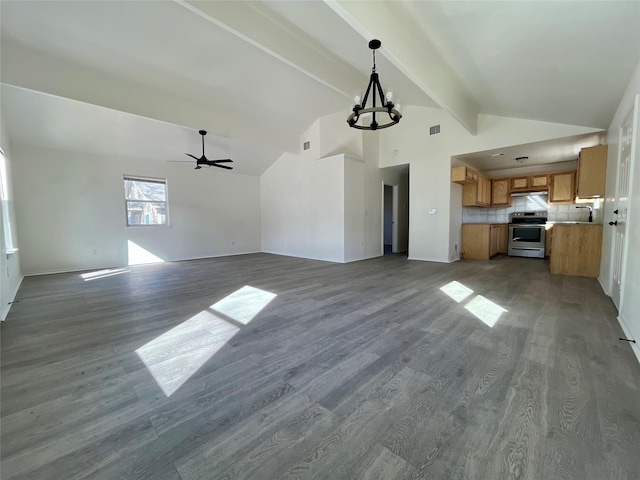 unfurnished living room with visible vents, dark wood finished floors, lofted ceiling with beams, a sink, and ceiling fan with notable chandelier