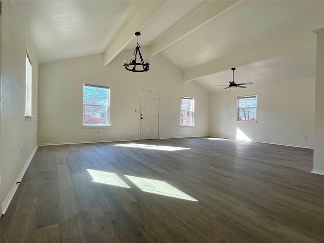 interior space with vaulted ceiling with beams, baseboards, and wood finished floors