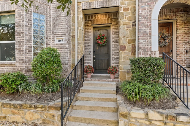 entrance to property with brick siding