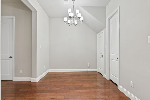 unfurnished dining area featuring lofted ceiling, visible vents, a chandelier, baseboards, and hardwood / wood-style flooring