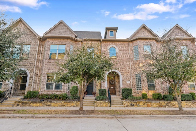 view of property with brick siding