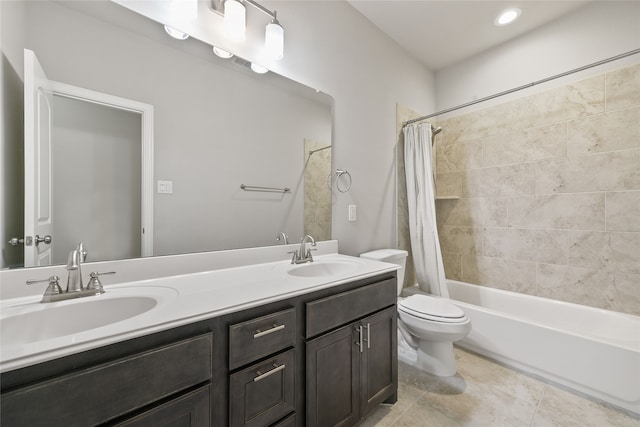 full bathroom featuring shower / bath combo with shower curtain, tile patterned flooring, a sink, and toilet