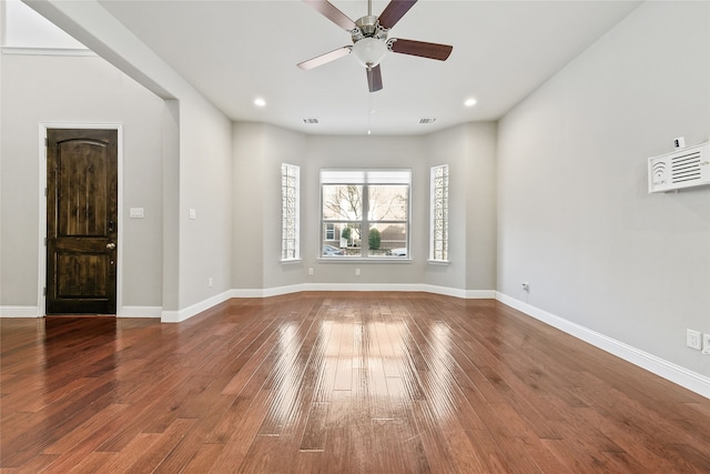 unfurnished room with recessed lighting, baseboards, and hardwood / wood-style floors