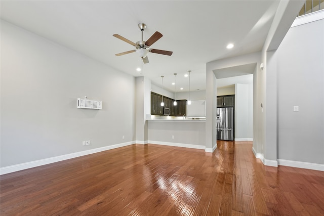 unfurnished living room with recessed lighting, ceiling fan, baseboards, and wood finished floors