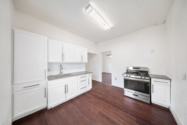 229 W Jerden, Dallas, TX 75208 - kitchen featuring dark wood-style floors, white cabinetry, a sink, and gas stove