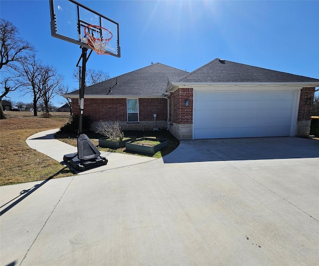 view of front facade featuring brick siding, driveway, and roof with shingles