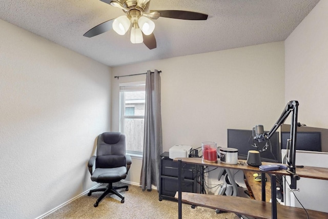 office space with carpet floors, ceiling fan, a textured ceiling, and baseboards