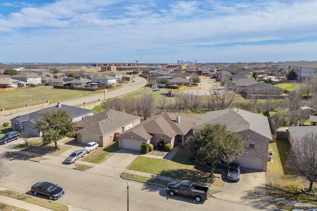 birds eye view of property with a residential view