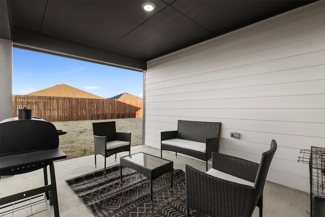 view of patio / terrace with area for grilling, outdoor lounge area, and fence