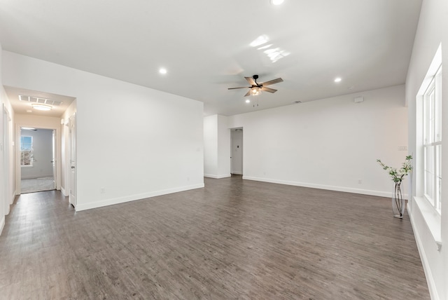 empty room with baseboards, visible vents, ceiling fan, wood finished floors, and recessed lighting