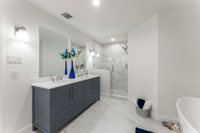 bathroom with marble finish floor, a sink, visible vents, and baseboards