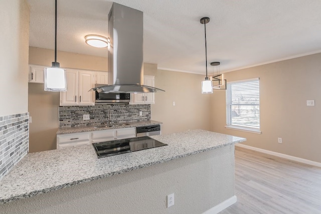 kitchen featuring black electric cooktop, island range hood, a sink, white cabinetry, and stainless steel dishwasher