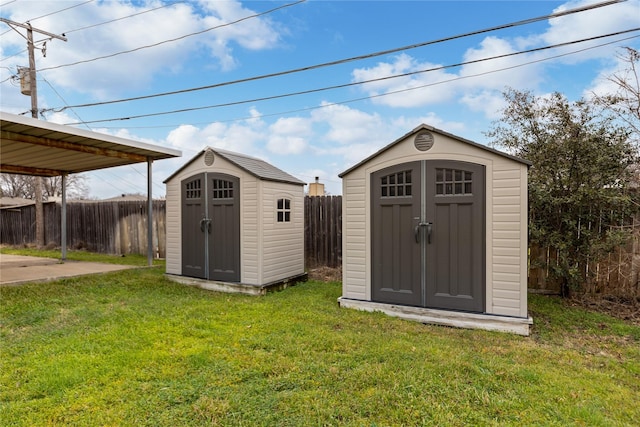 view of shed with a fenced backyard