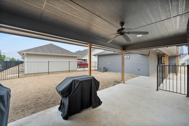 view of patio with ceiling fan, a fenced backyard, cooling unit, and an outdoor structure