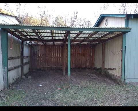 exterior space featuring a carport