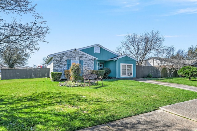 single story home featuring fence and a front yard