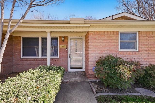 entrance to property with brick siding