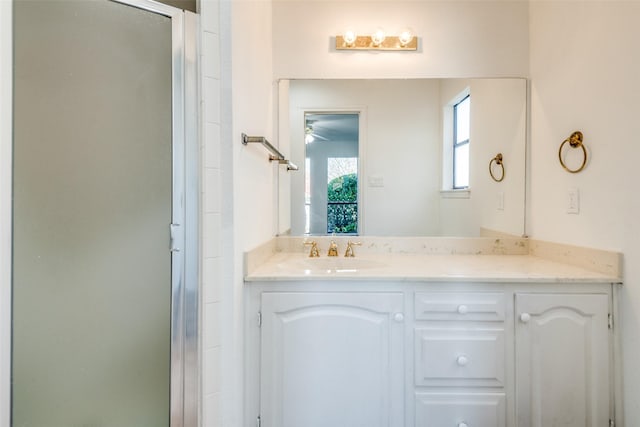 full bathroom featuring a shower stall and vanity