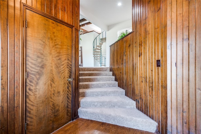 stairway with wood finished floors