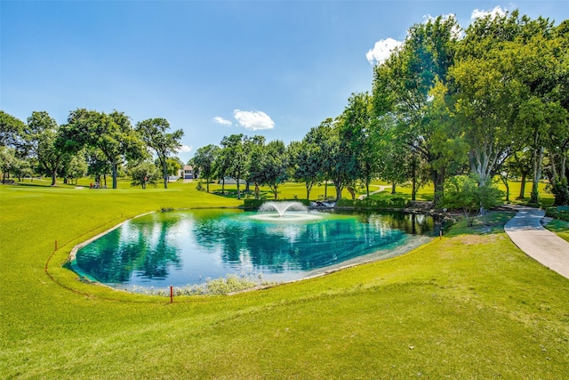 exterior space featuring a water view and a yard