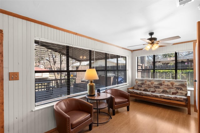 sunroom / solarium with ceiling fan and a wealth of natural light