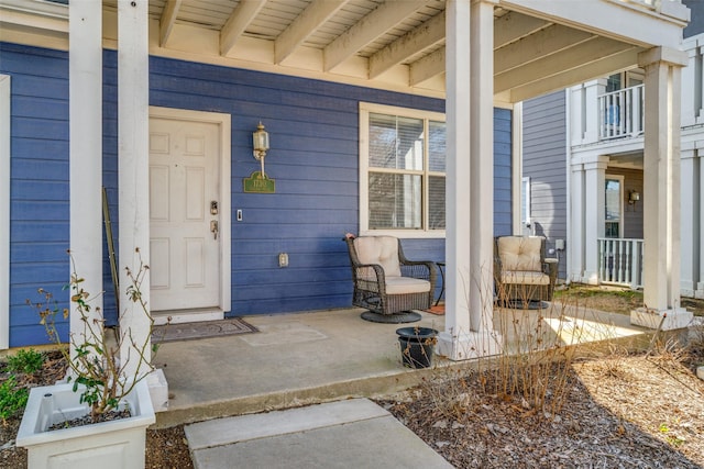 property entrance with covered porch