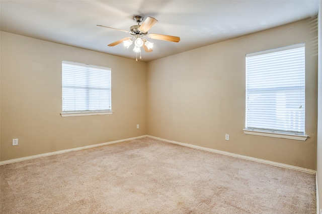 unfurnished room with ceiling fan and carpet floors