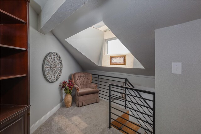 676 Harbor Dr, Azle, TX 76020 - living area with an upstairs landing, carpet floors, baseboards, and vaulted ceiling