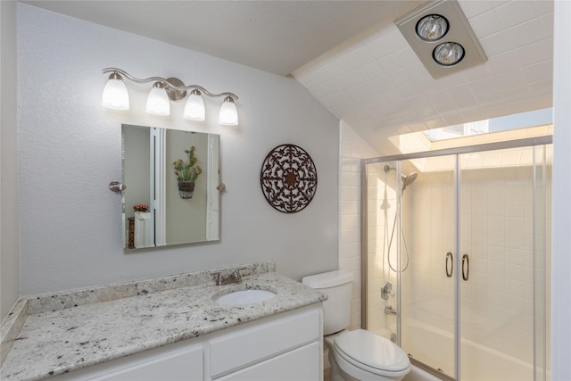 676 Harbor Dr, Azle, TX 76020 - full bathroom with a shower with shower door, toilet, vanity, and vaulted ceiling